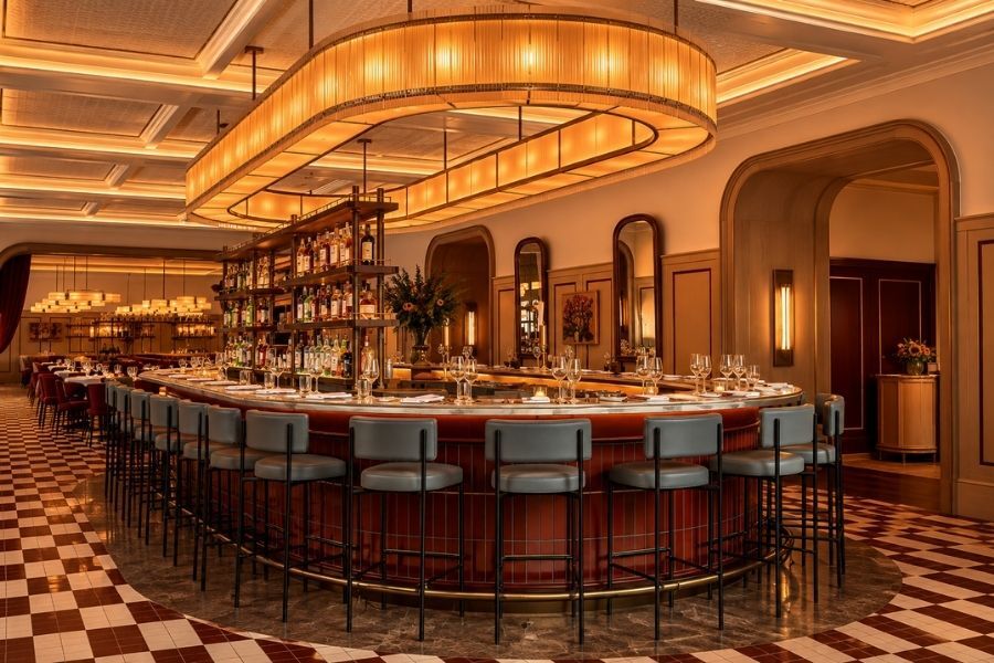 Large all day brasserie dining room with a central bar in Manhattan near Lincoln Center
