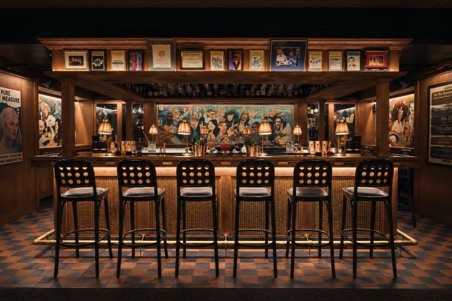 Wood paneled tavern dining room with red banquettes in downtown Manhattan